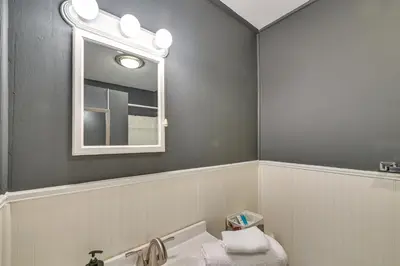 a bathroom with a sink and a mirror at Dry Ridge Rental Home with Hot Tub and Game Room! in Dry Ridge