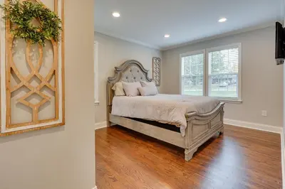 a bedroom with a large bed and a window at Powell Home with Fire Pit - 5 Mi to Columbus Zoo! in Powell