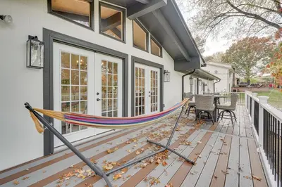 a hammock on the front porch of a house at Powell Home with Fire Pit - 5 Mi to Columbus Zoo! in Powell