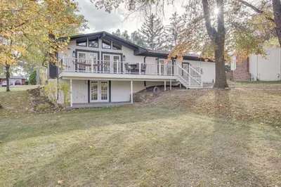 a large white house with a large yard at Powell Home with Fire Pit - 5 Mi to Columbus Zoo! in Powell