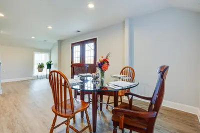 a dining room with a glass table and chairs at Spacious and Inviting Jackson Getaway with Fireplace! in Jackson