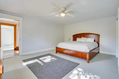 a bedroom with a bed and a ceiling fan at Spacious and Inviting Jackson Getaway with Fireplace! in Jackson