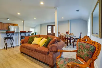 a living room with a couch and a kitchen at Spacious and Inviting Jackson Getaway with Fireplace! in Jackson