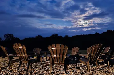 a group of chairs and a table on a beach at GameRoom, HotTub, Piano, 5mi to OldManCave - Hocking Hills Copper House in Laurelville