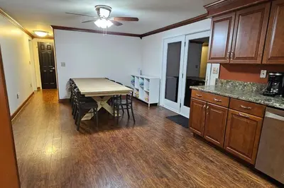 a kitchen with a table and chairs and a dining room at GameRoom, HotTub, Piano, 5mi to OldManCave - Hocking Hills Copper House in Laurelville