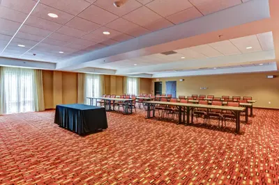 a conference room with tables and chairs in it at Courtyard by Marriott Bridgeport Clarksburg in Bridgeport