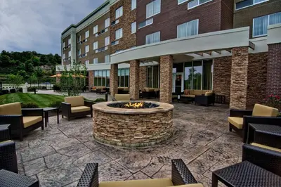 a patio with a fire pit in front of a building at Courtyard by Marriott Bridgeport Clarksburg in Bridgeport