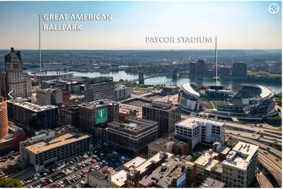 an aerial view of a city with a river and buildings at Downtown Stroll to the Bengals in Cincinnati