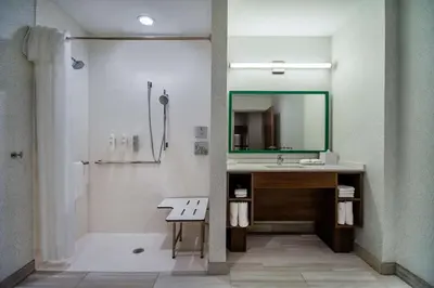 a bathroom with a sink and a mirror and a shower at Home2 Suites By Hilton West Chester Cincinnati in West Chester