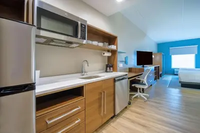 a kitchen with a sink and a desk in a room at Home2 Suites By Hilton West Chester Cincinnati in West Chester