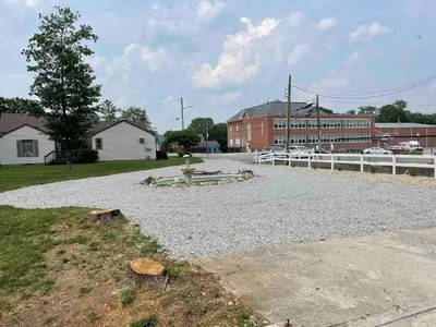 a park with a fountain in the middle of a road at Birchill Manor in Brookville