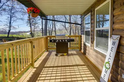 a grill on a deck on a house at Serene Logan Retreat with Hot Tub and Stargazing Dome in Logan