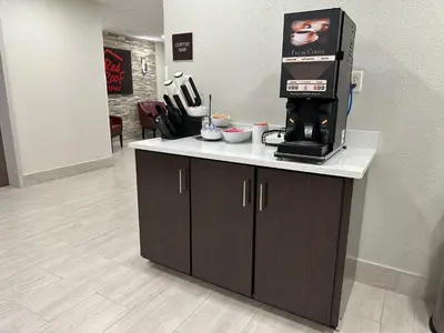 a coffee machine sitting on top of a counter at Red Roof Inn Charleston - Dunbar in Dunbar