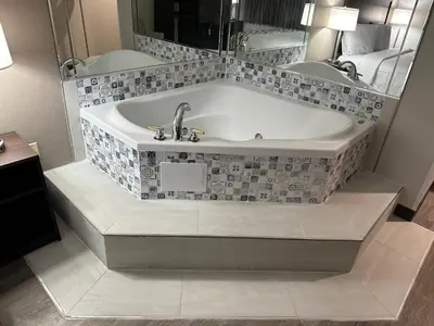 a bath tub with a sink in a bathroom at Red Roof Inn Charleston - Dunbar in Dunbar