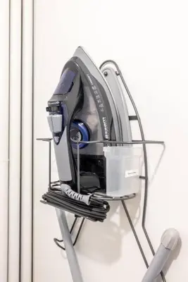 a sewing machine sitting on a metal stand at King & Queen First Floor Unit! 1-2c Georgetown Villas in Fairview Park