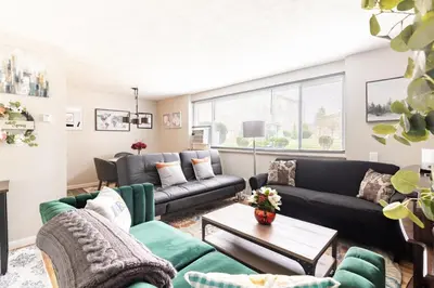a living room with couches and a table at King & Queen First Floor Unit! 1-2c Georgetown Villas in Fairview Park