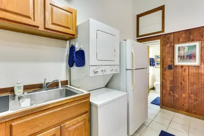 a kitchen with a white refrigerator and a sink at Chagrin Falls Home about 2 Mi to Town! in Chagrin Falls