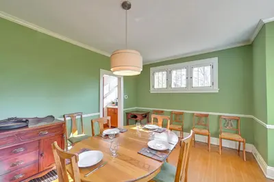 a dining room with a wooden table and chairs at Near Downtown Cincinnati Peaceful Retreat! in Blue Ash
