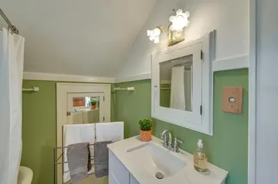 a bathroom with a sink and a mirror at Near Downtown Cincinnati Peaceful Retreat! in Blue Ash