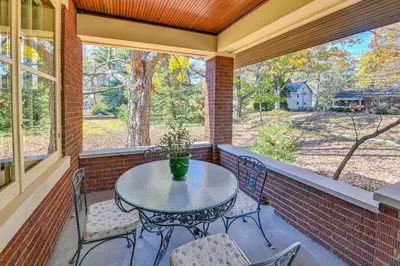 a patio with a table and chairs and a window at Near Downtown Cincinnati Peaceful Retreat! in Blue Ash