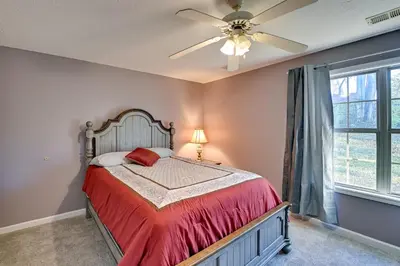 a bedroom with a bed and a ceiling fan at Georgetown Home about 6 Mi to Kentucky Horse Park! in Georgetown