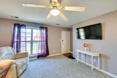 a living room with a couch and a ceiling fan at Georgetown Home about 6 Mi to Kentucky Horse Park! in Georgetown