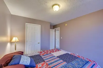 a bedroom with a bed with a quilt on it at Georgetown Home about 6 Mi to Kentucky Horse Park! in Georgetown