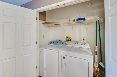 a white laundry room with a washer and dryer at Georgetown Home about 6 Mi to Kentucky Horse Park! in Georgetown