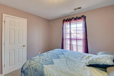 a bedroom with a bed and a window at Georgetown Home about 6 Mi to Kentucky Horse Park! in Georgetown