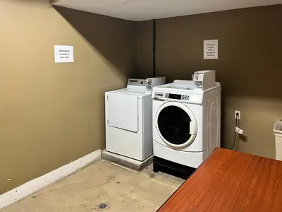 a washer and dryer sitting in a room at Studio 6 Suites Springfield, OH in Springfield