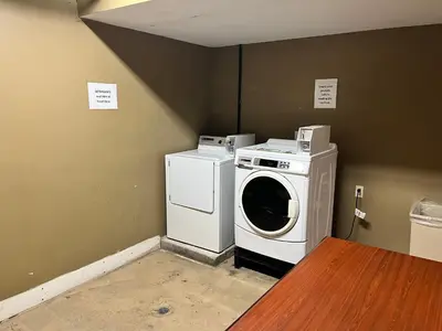 a washer and dryer sitting in a room at Studio 6 Suites Springfield, OH in Springfield