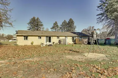 a house with a camera in front of it at Family-Friendly Home with Fire Pit about 10 Mi to Akron! in Uniontown
