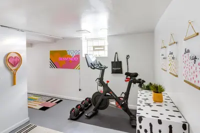 a room with a gym with an exercise bike at Gordon Square Studio about 4 Mi to Downtown Cleveland! in Cleveland