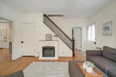 a living room with a couch and a fireplace at Peninsula Paradise - Walk to Hiking and Shopping! in Peninsula