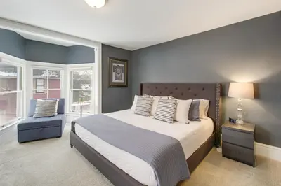 a bedroom with a large bed and a window at Peninsula Paradise - Walk to Hiking and Shopping! in Peninsula
