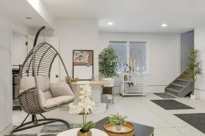 a living room with a swing chair in a room at Peninsula Paradise - Walk to Hiking and Shopping! in Peninsula