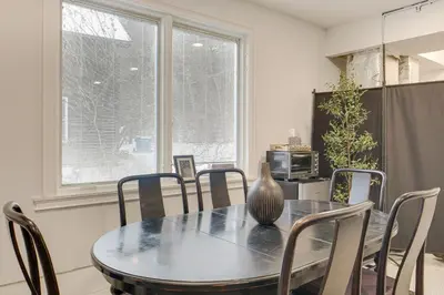 a dining room table with chairs and a vase on it at Peninsula Paradise - Walk to Hiking and Shopping! in Peninsula