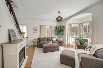a living room with a couch and a fireplace at Peninsula Paradise - Walk to Hiking and Shopping! in Peninsula