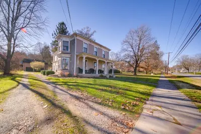 a house on a street with a driveway at Peninsula Paradise - Walk to Hiking and Shopping! in Peninsula