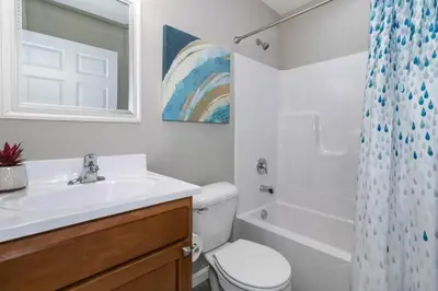 a bathroom with a sink and a toilet and a shower at Home among the Nook in Hamilton Ohio in Hamilton