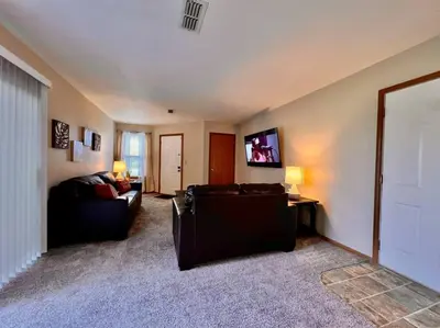 a living room with a couch and a tv at Cozy 2 Bedroom Paired Home in Middletown, OH in Middletown