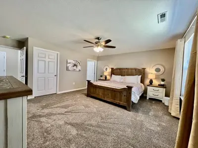 a bedroom with a bed and a ceiling fan at Peaceful, Brand New Ranch Home in Trenton, OH in Trenton