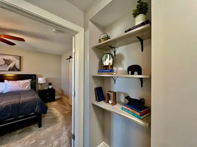 a bedroom with a bed and shelves in a room at Quaint 4 Bedroom Ranch Home in Mason Ohio in Mason