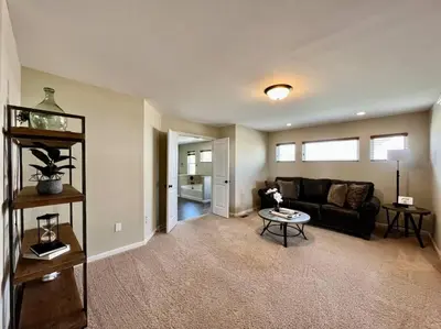 a living room with a couch and a table at Exclusive Golf Club Paradise in Lebanon