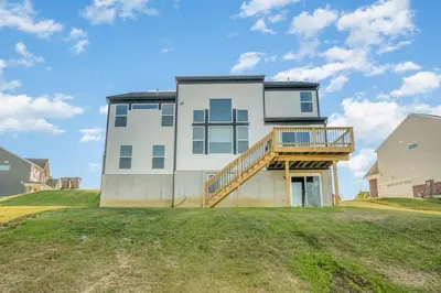 a house on top of a grassy hill at Cul de sac home in Family friendly community in Maineville