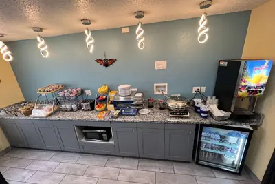 a kitchen with a counter with food on it at Days Inn by Wyndham Batavia Ohio in Batavia