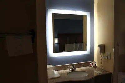 a bathroom with a sink and a mirror at Days Inn by Wyndham Batavia Ohio in Batavia