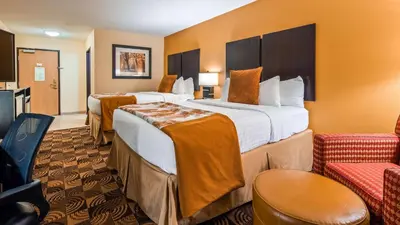 a hotel room with two beds and a kitchen at Best Western Plus Whitewater Inn in Harrison