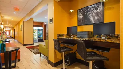 a hotel lobby with a bar with a tv on the wall at Best Western Plus Whitewater Inn in Harrison