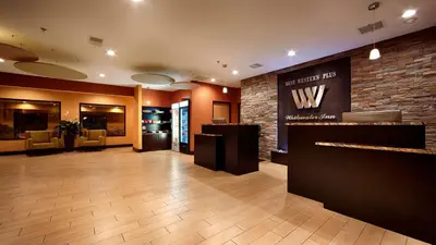 a lobby of a hotel with a wii sign on the wall at Best Western Plus Whitewater Inn in Harrison